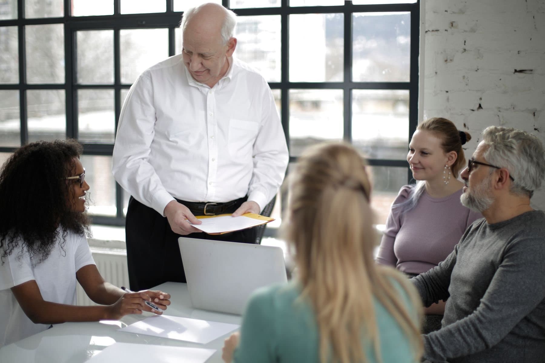 Someone leading a seated group through material